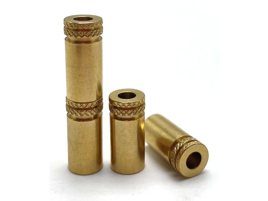 Custom knurled brass inserts and turned threaded components
